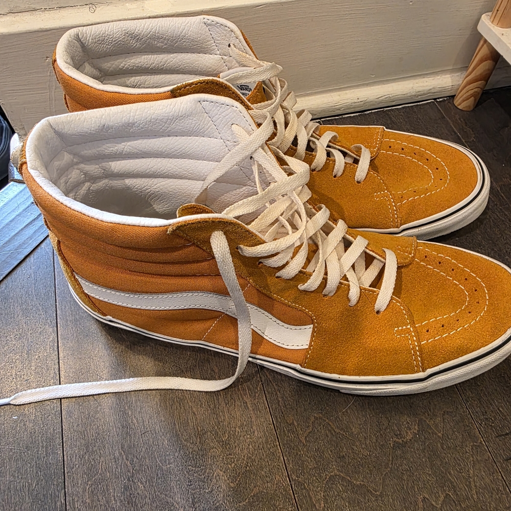 Vans Sk8-Hi high-top sneaker in an orange Amd White.